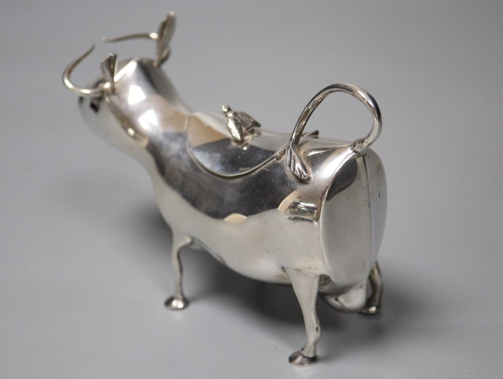 A mid 20th century Dutch white metal cow creamer, length 14cm, gross 145 grams.